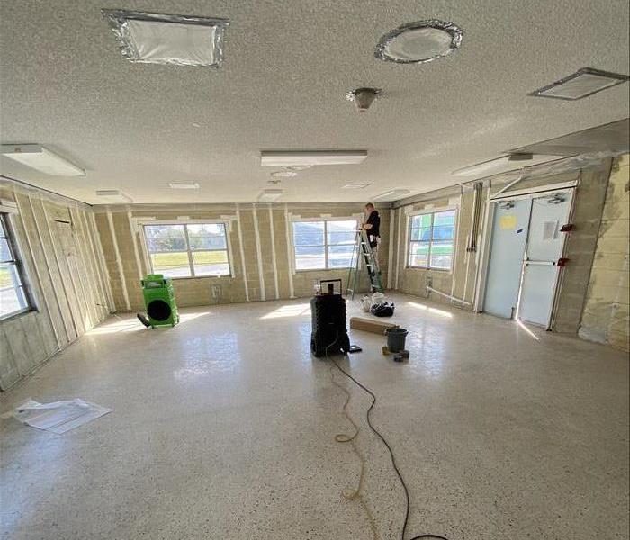 empty room being cleaned by a technician 